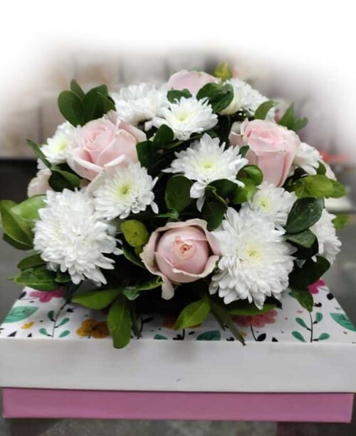 Sweet pink roses and white chysanthimum round arrangement