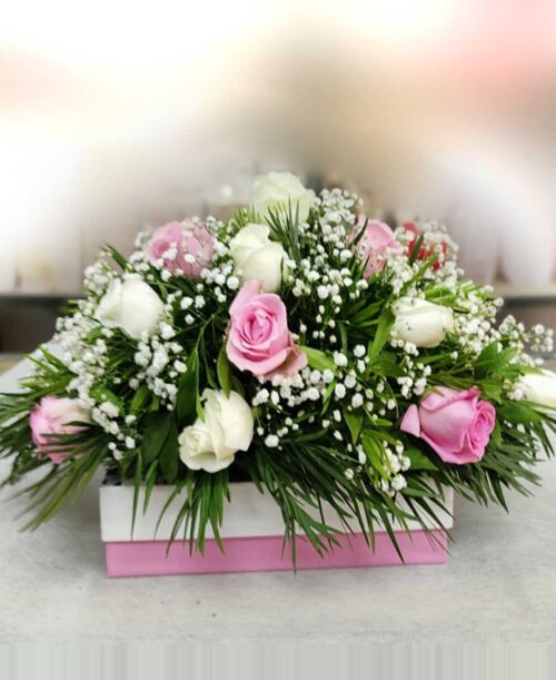 Wreath with pink and white roses flower arrangement